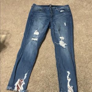 Ripped dark blue jeans